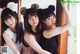 A group of three young women wearing bear ears.